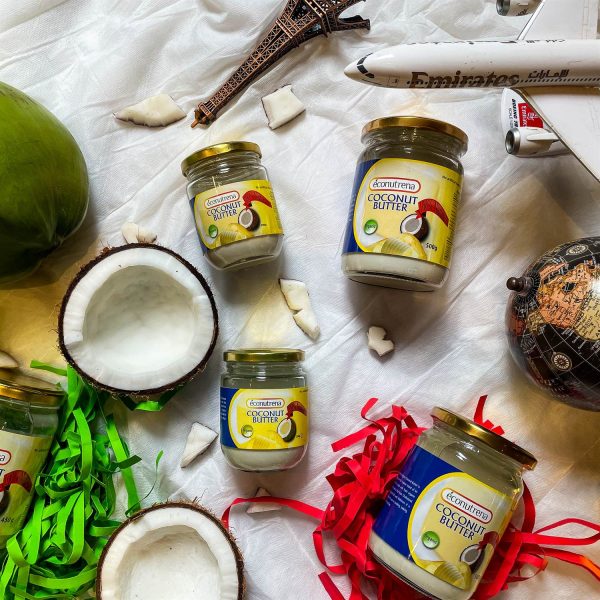 Jar of Econutrena Organic Coconut Butter on a wooden table